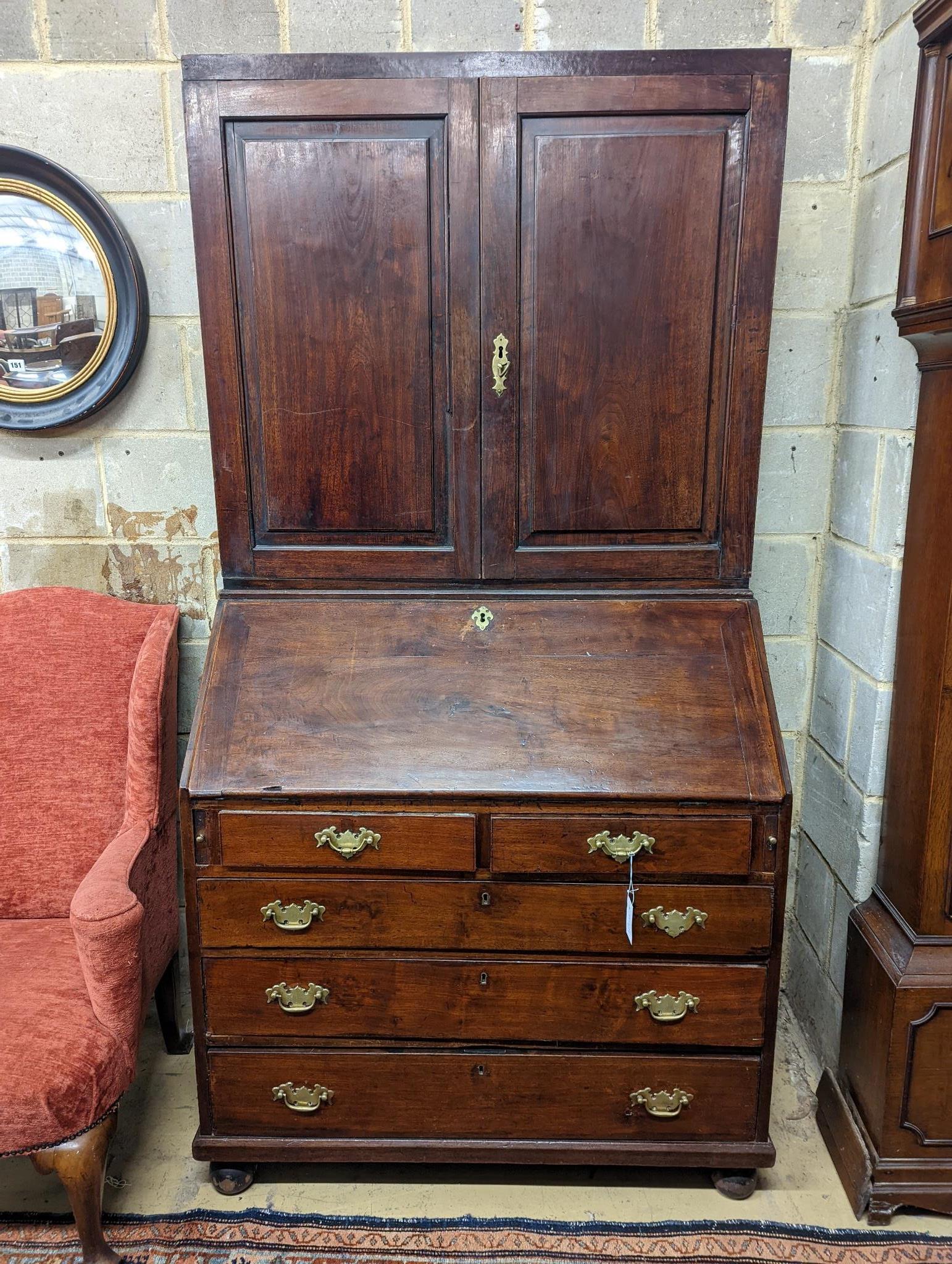 A George III mahogany bureau cabinet, width 102cm, depth 55cm, height 198cm